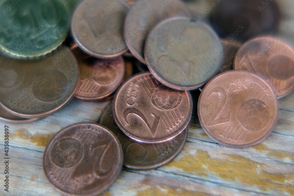 Euro currency coins coins on a old background. Inflation, business, economics and finance theme.