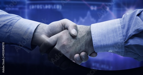 Mid section of two businessmen shaking hands against financial data processing on blue background
