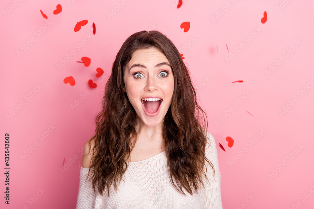 Photo of young attractive girl happy positive smile amazed surprised fly air serpentine isolated over pastel color background Photo of young attractive girl happy positive smile amazed surprised fly air serpentine isolated over pastel color background