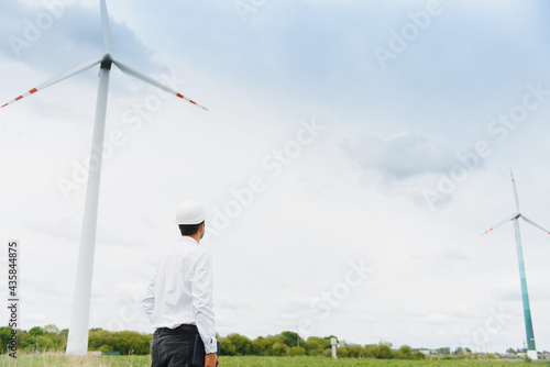 Windmill engineer inspection and progress check wind turbine at construction site.