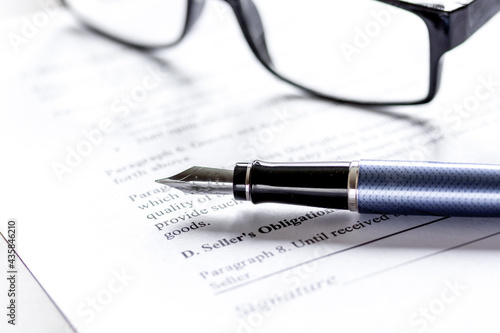 office desk with signing contract, glasses and pen for business