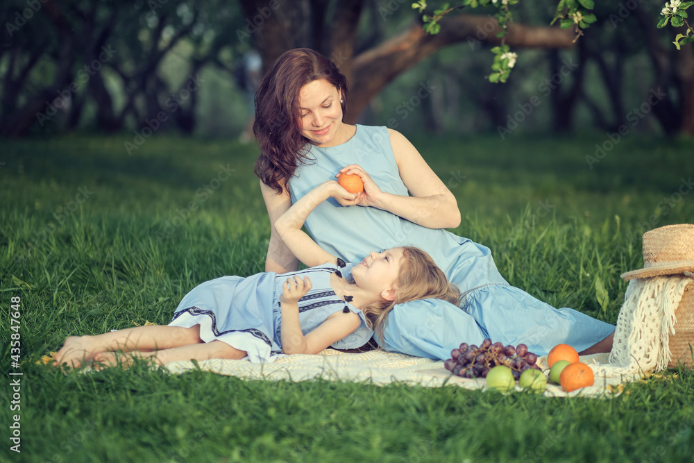 mother and child having fun in the park. Mother and little daughter playing together in a park. Happy family concept. mother and child having fun in the park. Mother and little daughter playing together in a park. Happy family concept.