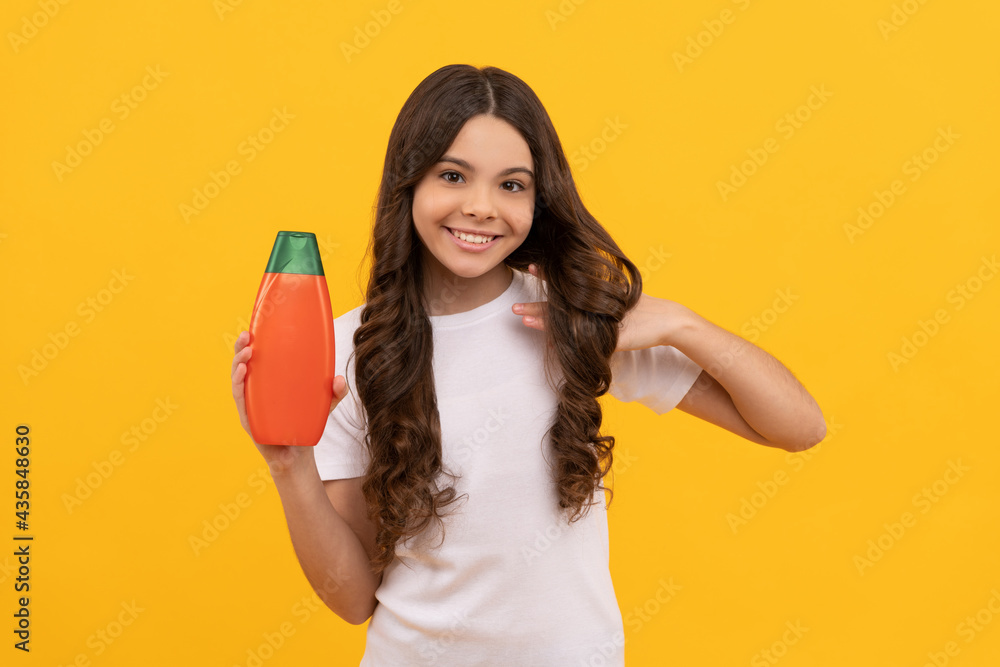 happy girl hold shampoo bottle. child with hair conditioner. daily habits and personal care. happy girl hold shampoo bottle. child with hair conditioner. daily habits and personal care.