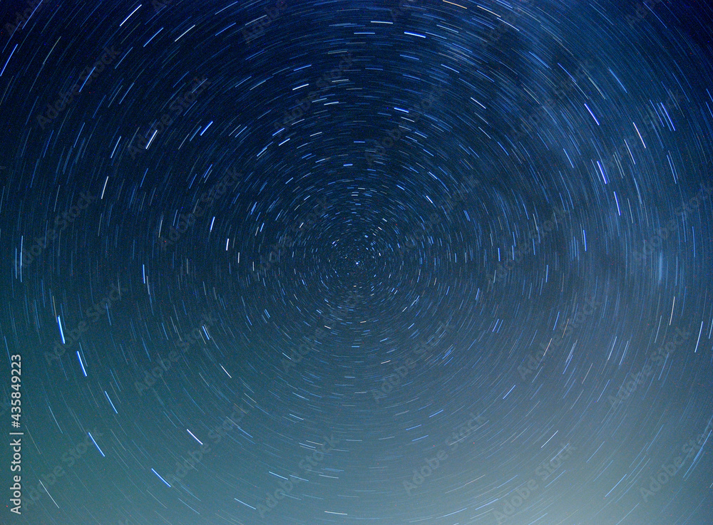 Star trails with north star in the center showing Earth rotation