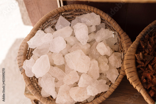 White crystals of mishri on the black background photo