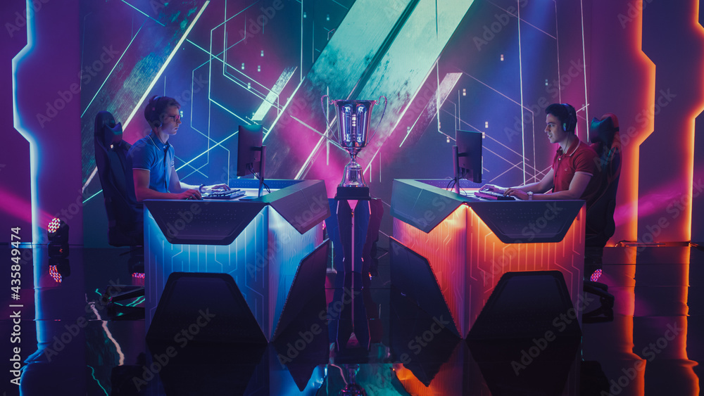 Two Professional Esport Gamers Competition in a Video Game on a Championship Arena, Both Playing Computer Games. Global Online Streaming Cyber Games Tournament 