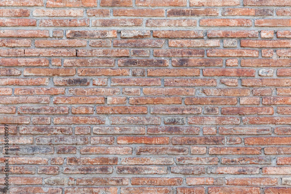 Fototapeta premium Vintage brown stone brick wall pattern and background seamless