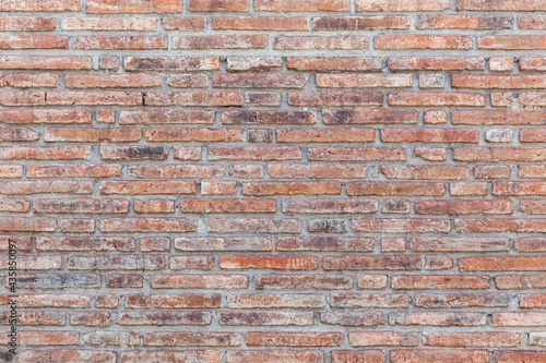 Vintage brown stone brick wall pattern and background seamless