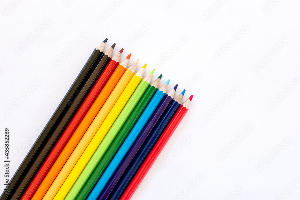 Many colorful pencil isolates placed on white paper. Many colorful pencil isolates placed on white paper.