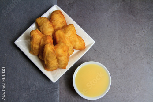 Thai dessert Patongo with Condensed milk photo