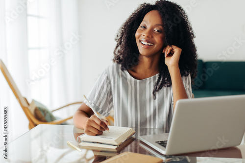 Happy woman working at home office