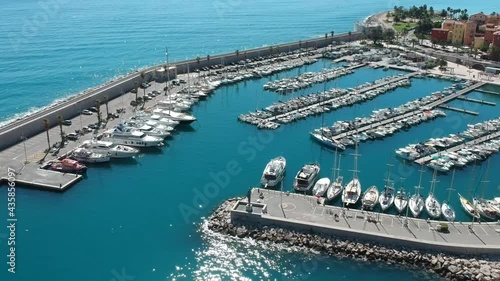 Aerial footage pan to the right showing the Vieux Port, Sablette beach, Saint Michel Basilica - Menton, France | Pearl of French Riviera, Côte d'Azur by Drone photo