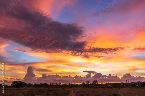 blue bright and orange yellow dramatic sunset sky in countryside texture background.