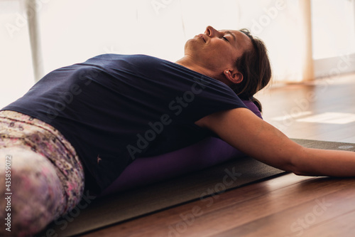 white woman practices yoga