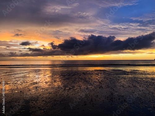 golden colourful mirror sunset at beach with reflection at kota kinabalu malaysia