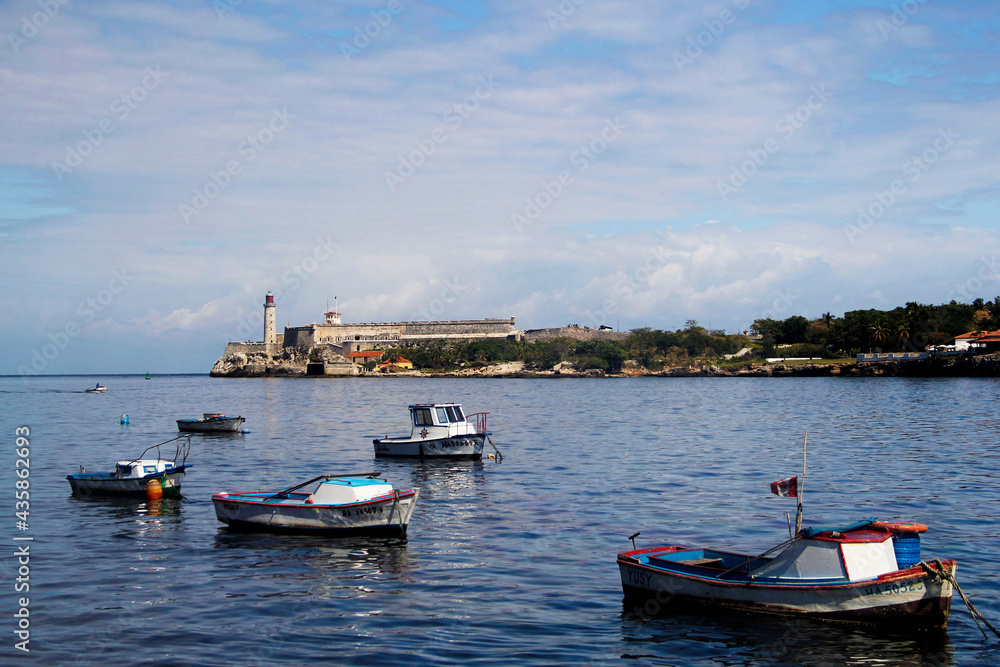 the waterfront with a view of the lighthouse in Havana