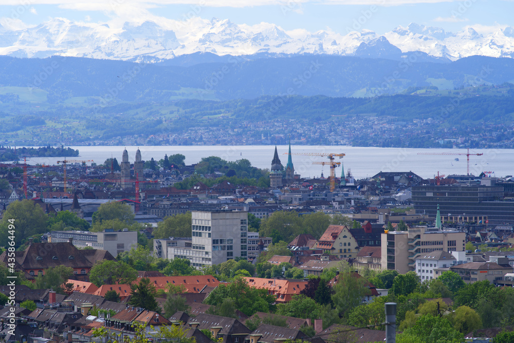 Zurich skyline at springtime with Lake Zurich and Swiss alps in the background. Photo taken May 26th, 2021, Zurich, Switzerland.