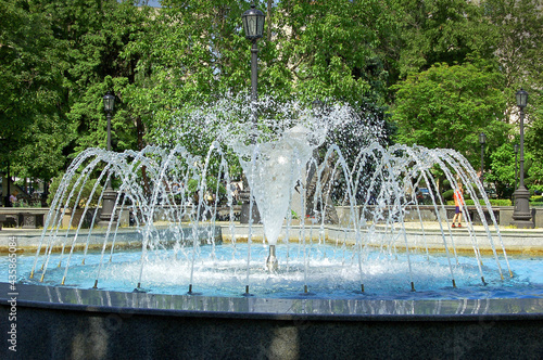 Fountain in the city park on a summer day