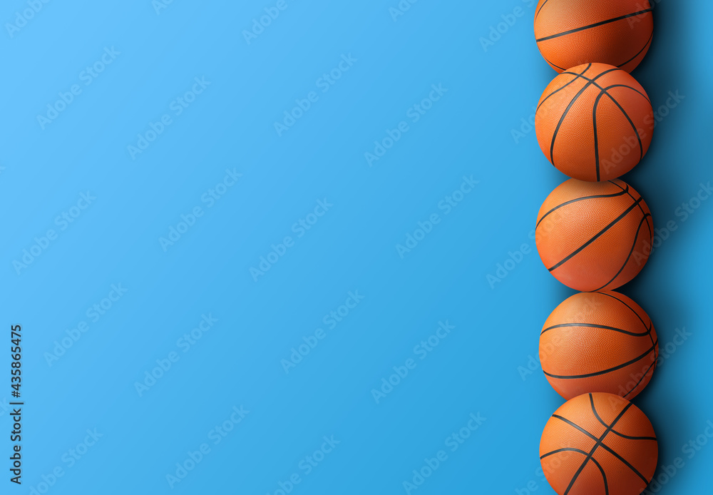 Obraz premium Many orange basketball balls on blue background. Space for text