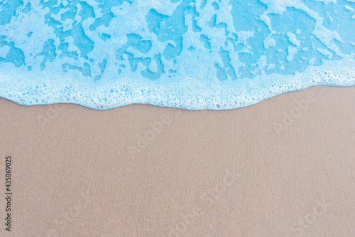 Beautiful ocean waves on the sandy beach Abstract style nature background pastel tones © photosky99