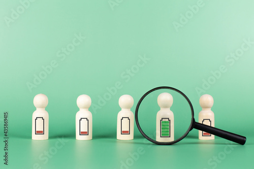 Canvas Print Magnifying glass with choose human icon to full level energy battery green