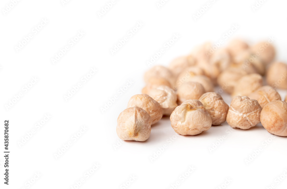 Isolated dry chickpeas. Versatile superfood legume, high in protein and fiber. Known as garbanzo bean, bengal gram or Cicer arietinum. Used for hummus, veggie burgers and falafel. Selective focus. Isolated dry chickpeas. Versatile superfood legume, high in protein and fiber. Known as garbanzo bean, bengal gram or Cicer arietinum. Used for hummus, veggie burgers and falafel. Selective focus.