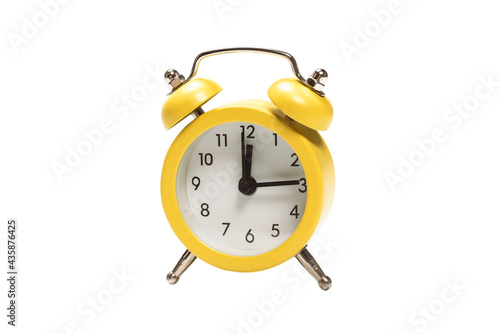 Yellow alarm clock isolated on a white.