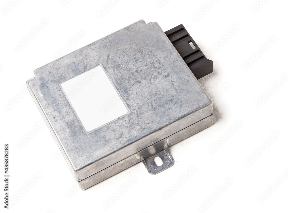 Plastic car engine control unit with metal elements on a white isolated background is the connecting center of various subsystems, units and assemblies. Monitoring the state of the moment. Spare part