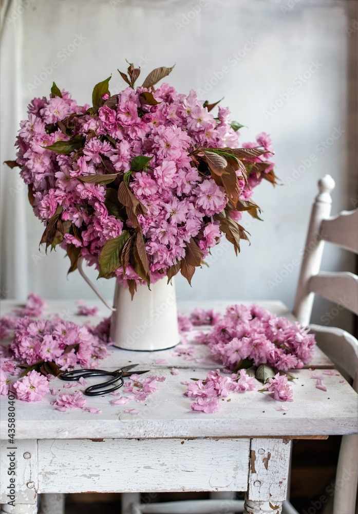 Fototapeta premium Beautiful bouquet pink flowers. lilac flowers. cherry flowers in vase .