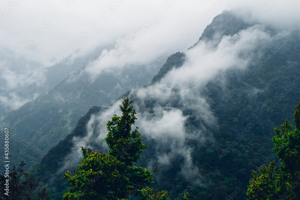 The deep mountains surrounded by clouds and mist look very mysterious and solemn