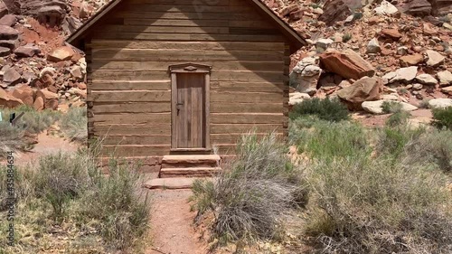 Panning shot of an old schoolhouse in Fruita, Utah in Capitol Reef National Park photo