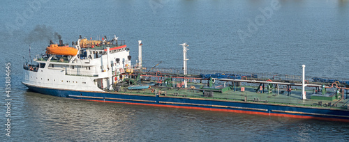 Cargo tank on water. Bulk oil carrier ship photo