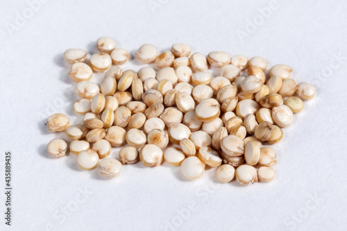 white quinoa seeds close up macro isolated on white background