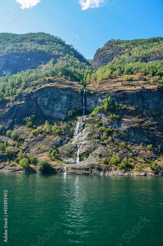 A waterfall in a stunning setting along the Sognefjord between the villages of Flam and Gudvangen in Norway