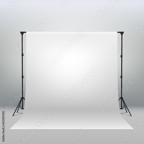 Professional photo studio interior. Photography tripods and racks and paper roll