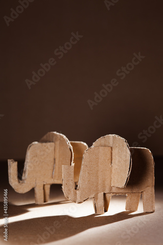 Elephant made of cardboard on a dark background. Children art project. DIY concept. Cardboard craft.