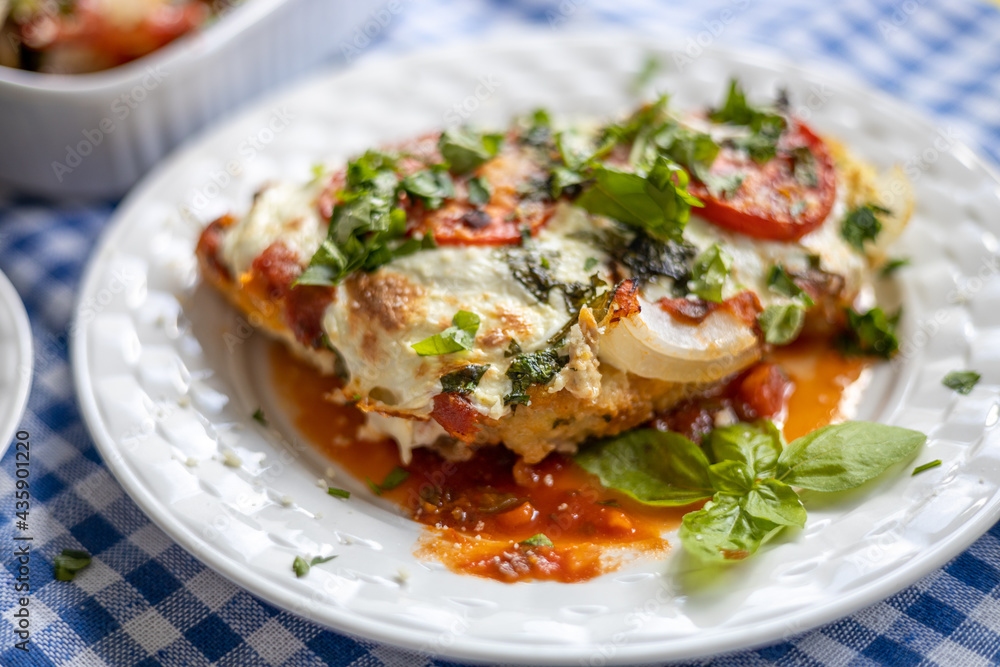 Delicious homemade Chicken Parmesan from a closeup angle Delicious homemade Chicken Parmesan from a closeup angle