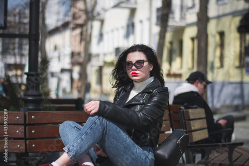 A beautiful young brunette hipster girl on the street of her city