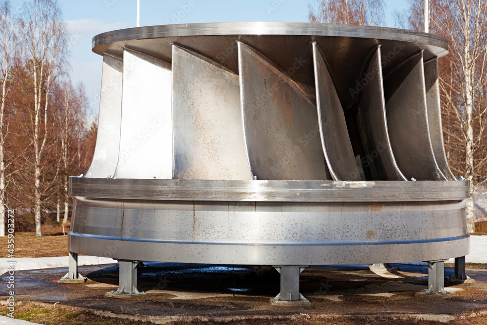 an old turbine for a hydroelectric power plant as an exhibition Stock