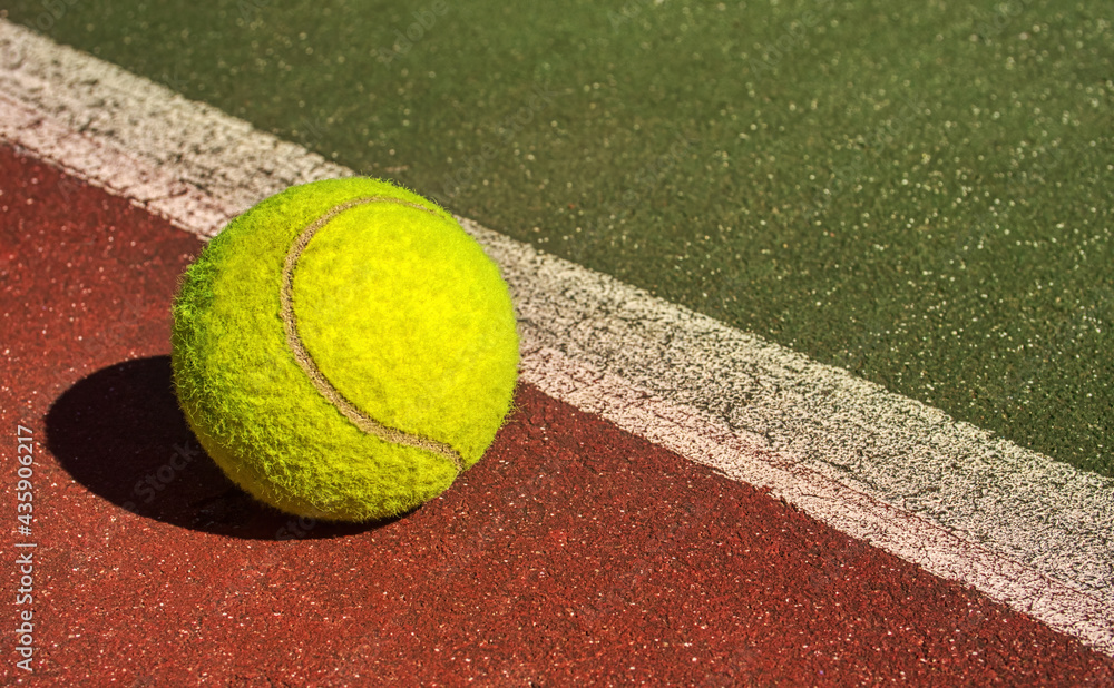 Tennis ball on the court, out of the line . A close up, sports photo concept