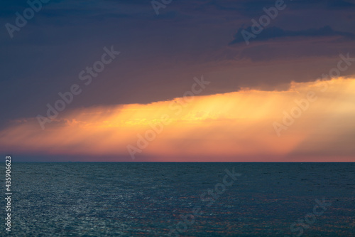 Morning cloudy sunrise landscape over the sea background