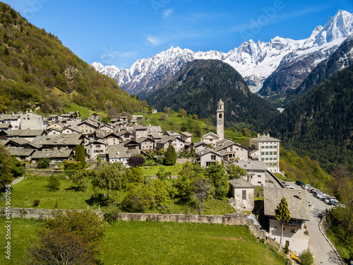 Aerial image of the Swiss mountain village Solio with the snow-capped Sciora range at the background. Soglio was creadited as one the most beautiful village in Switzerland.
