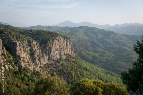 Morning landscape just after sunrise. The sun's rays fall on the mountain valley. Aerial view of Koprulu National Park near ancient city of Selge Adam Kayalar, Turkey. Koprulu Canyon.