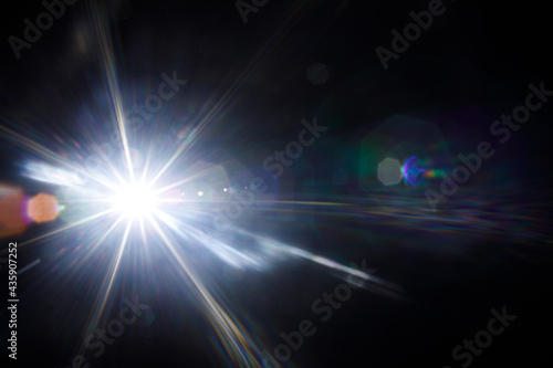 Easy to add lens flare effects for overlay designs or screen blending mode to make high-quality images. Abstract sun burst, digital flare, iridescent glare over black background.