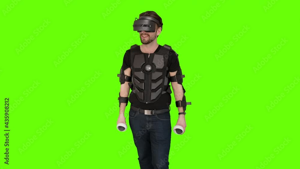 Nerdy gamer man folds down display robocop VR virtual reality production green screen gaming headset setup gear chest plate armor shooting game guy oculus quest 2 windows future sci-fi entertainment Nerdy gamer man folds down display robocop VR virtual reality production green screen gaming headset setup gear chest plate armor shooting game guy oculus quest 2 windows future sci-fi entertainment