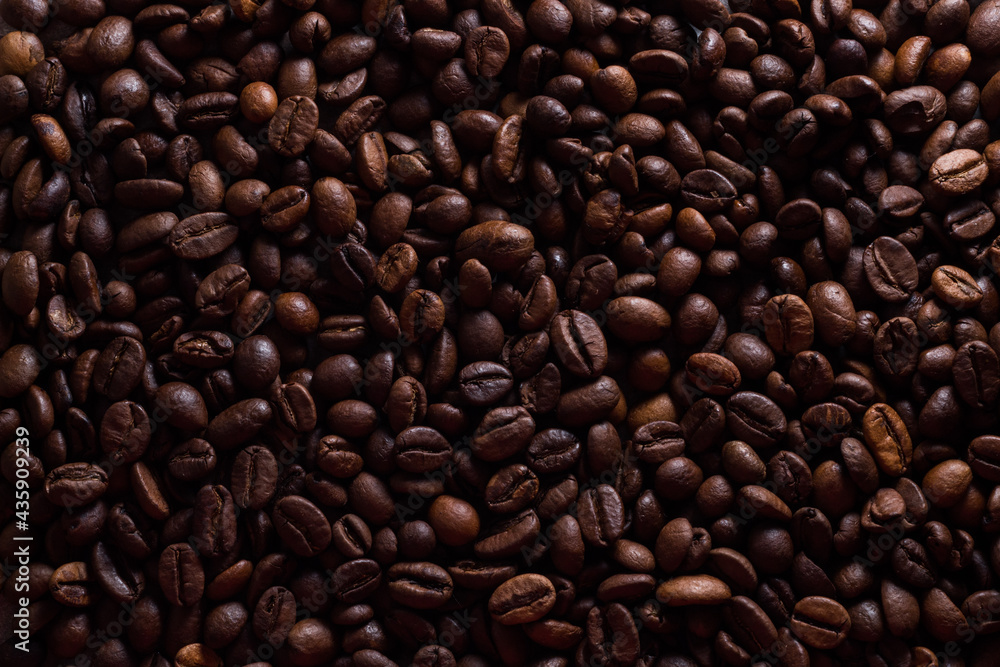 Fototapeta premium Background of coffee beans. brown food background. medium roasted grains