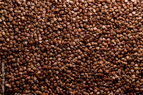 Background of buckwheat. brown natural background. texture © Natalia