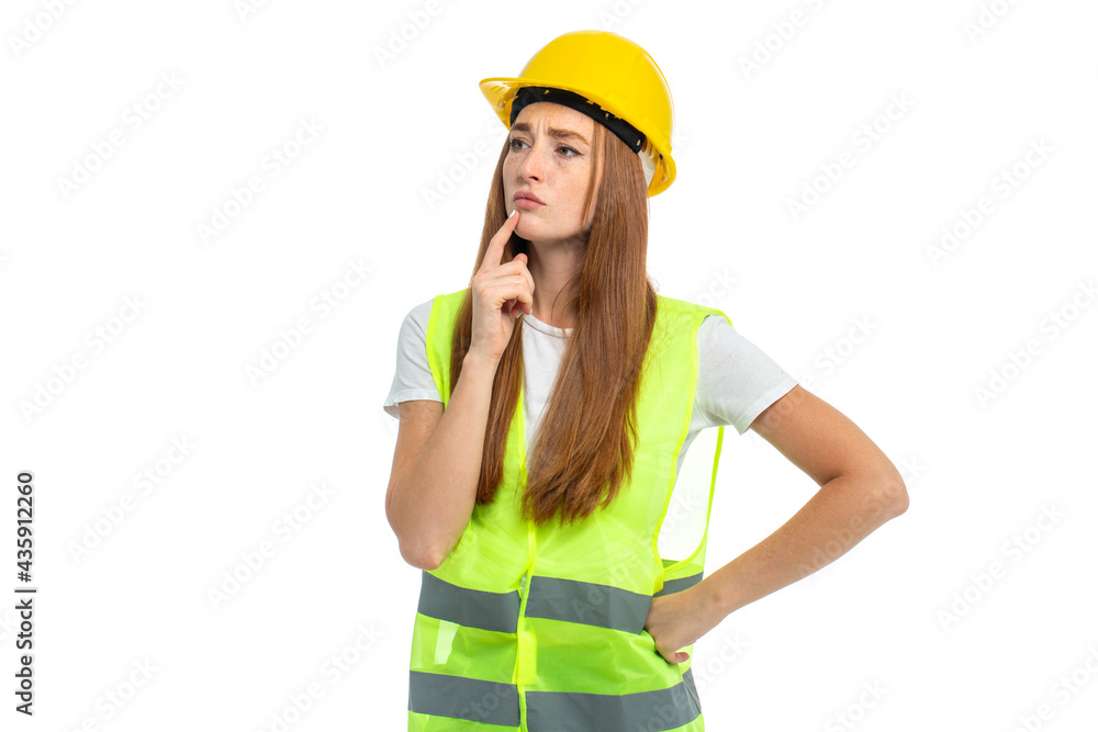 Young beautiful woman with red hair in helmet at studio Young beautiful woman with red hair in helmet at studio