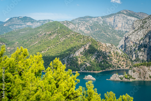 Dam lake in Green Canyon. Beatiful View to Taurus Mountains and turquoise water. Coniferous forest with bright green pine trees. Manavgat  Turkey