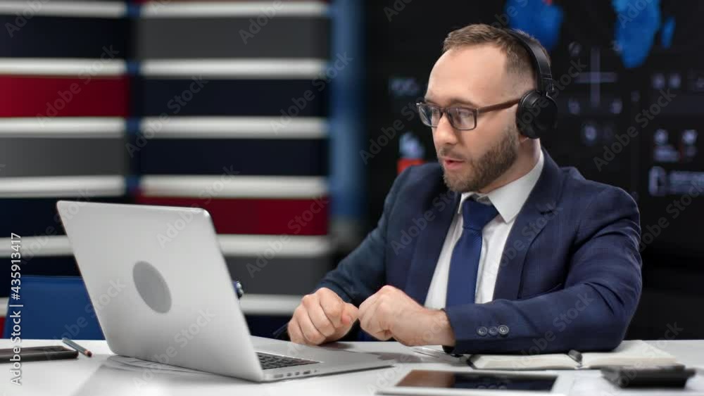 Male boss wearing headset talking online video call use laptop at innovation office workplace Male boss wearing headset talking online video call use laptop at innovation office workplace